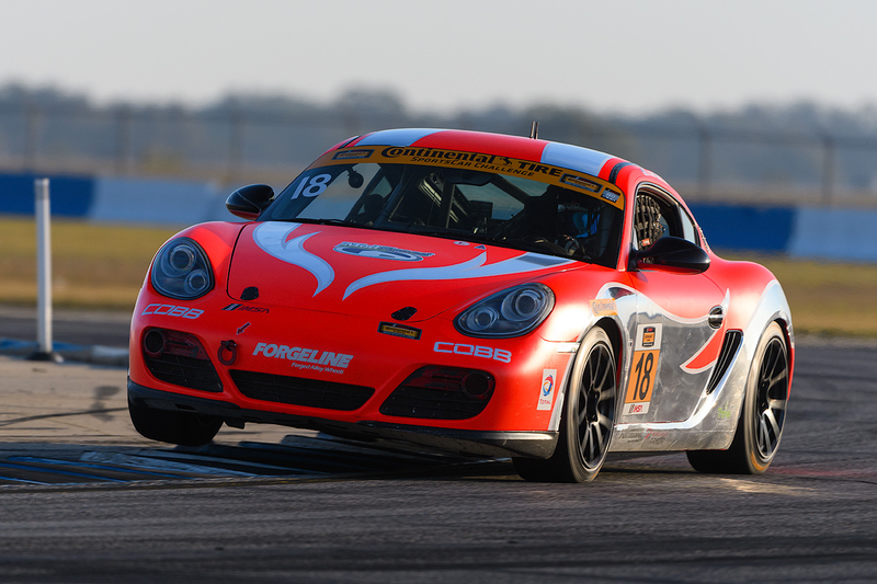 Straus’ No. 18 Porsche Cayman race car in the IMSA Continental Tire SportsCar Challenge, after she was told she’d never be aggressive enough to get the hang of this kind of thing. Photo credit: Wes Duenkel, used with permission